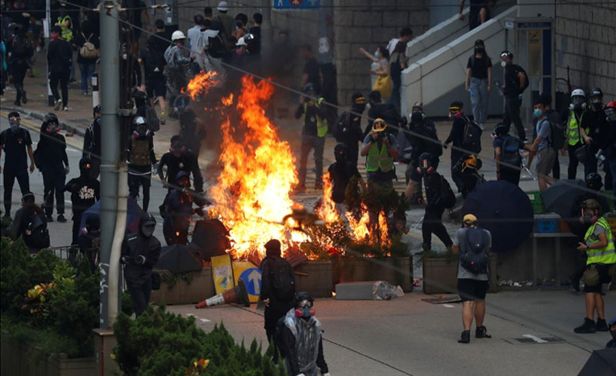 Street fires burn in Hong Kong amid battles between protesters, police