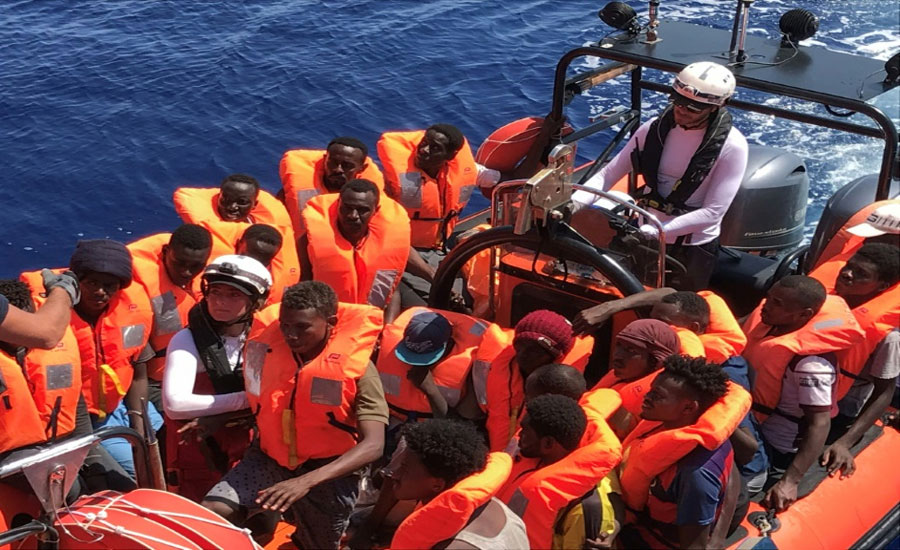 New Italian government lets 82 rescued migrants disembark