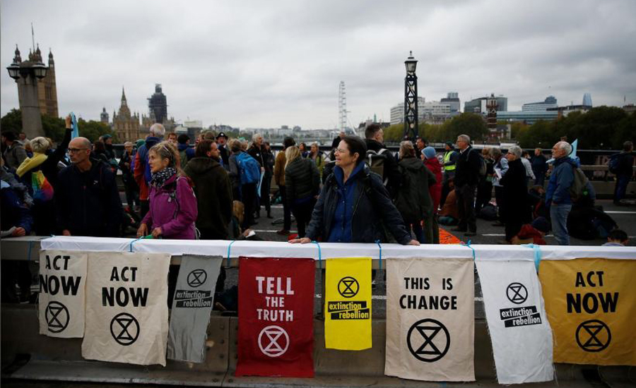 London police arrest 21 climate change protesters as mass action starts