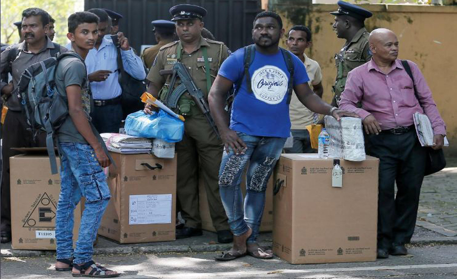 Sri Lankans vote for a new president to heal divisions
