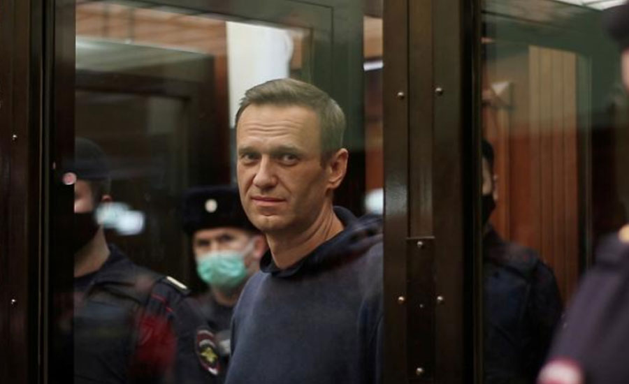 Russia to try jailed Kremlin critic Navalny for slander amid EU talks