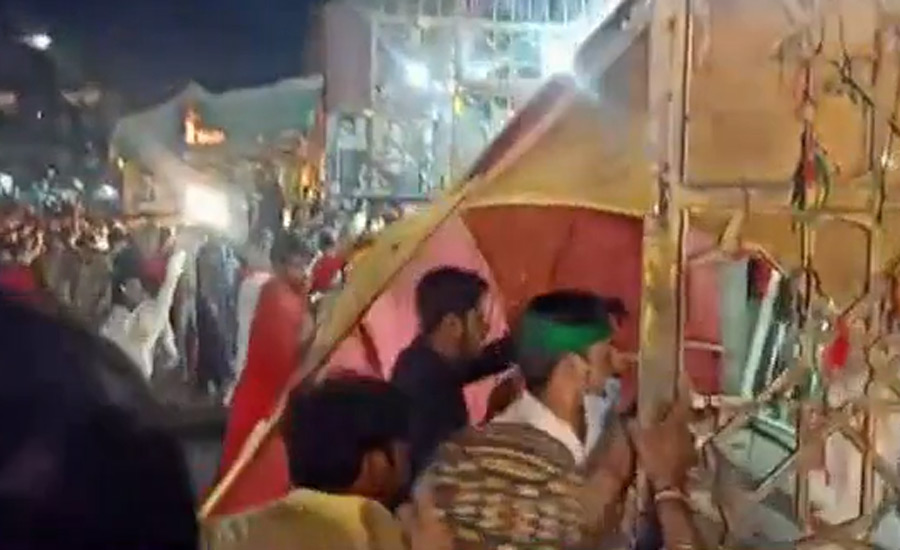 Devotees enter Hazrat Lal Shahbaz Qalandar's shrine after breaking open main gate