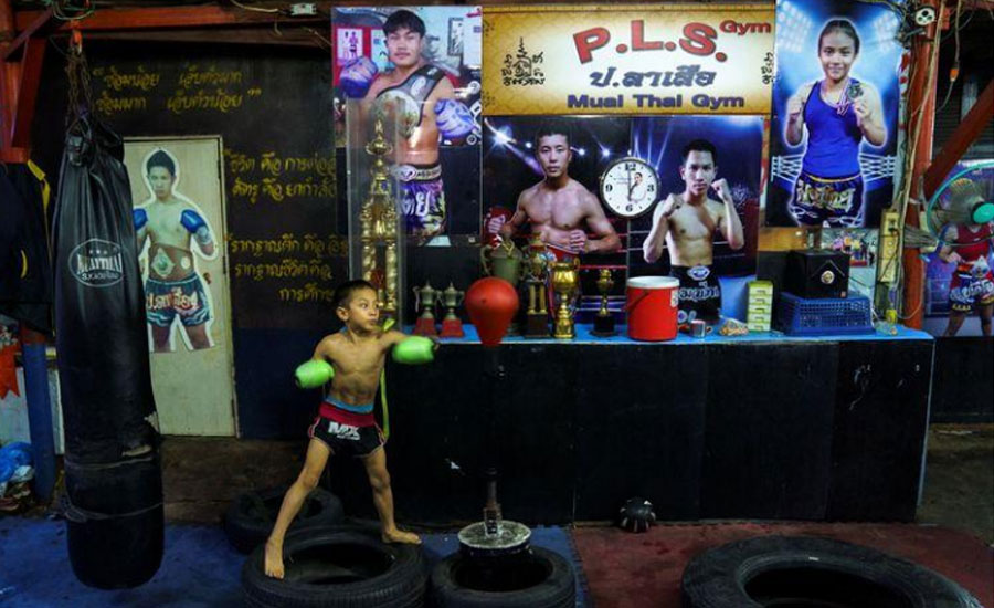 Punching out of poverty: Despite risks, 9-year-old Thai fighter eager to return to ring