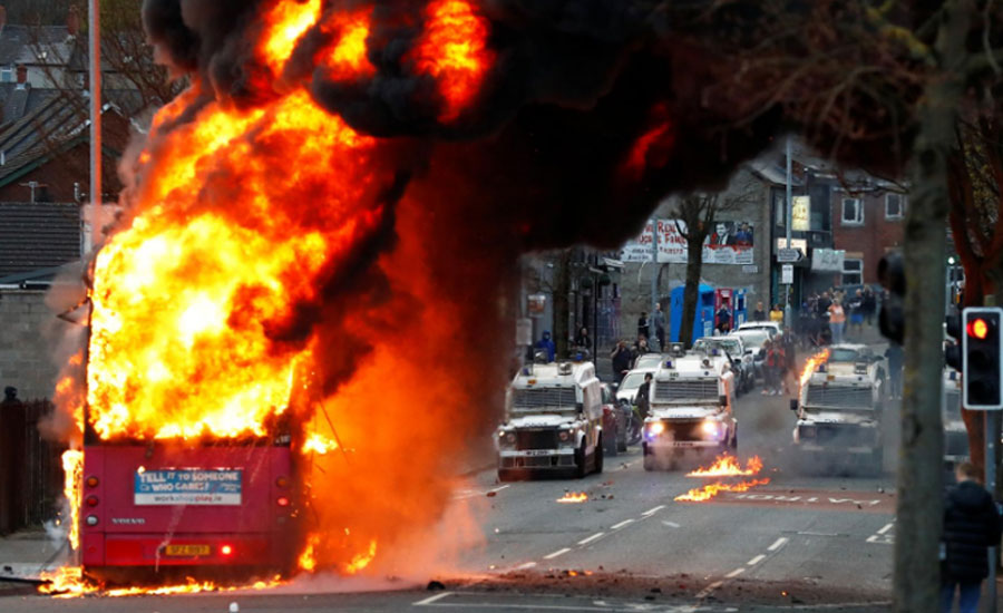 UK PM urges calm as Belfast protesters hijack bus, attack police