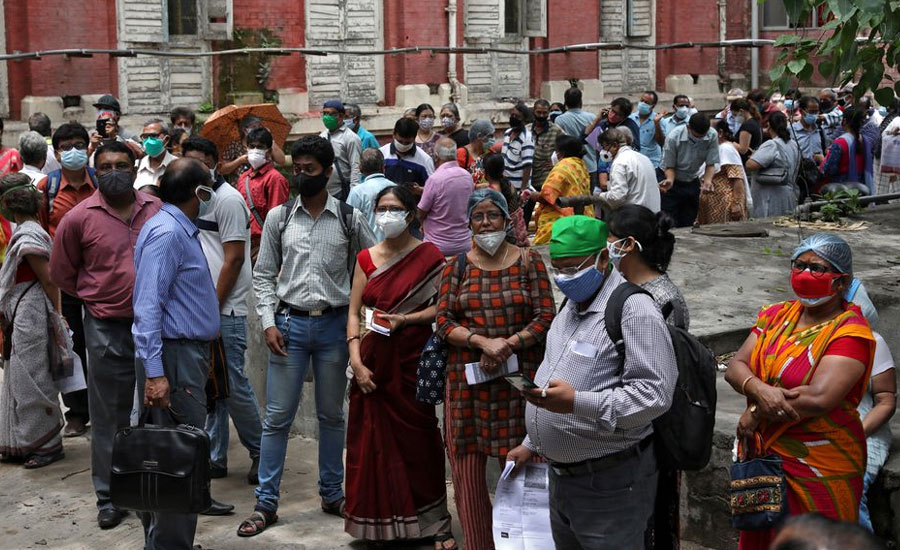 India's virus cases lower but WHO expert says positive tests ominously high