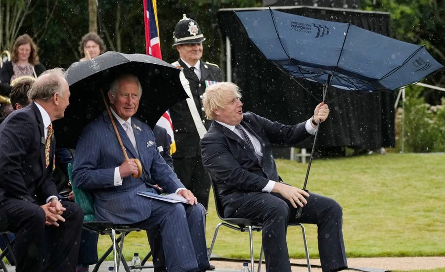 UK PM Johnson's umbrella mishap amuses Prince Charles