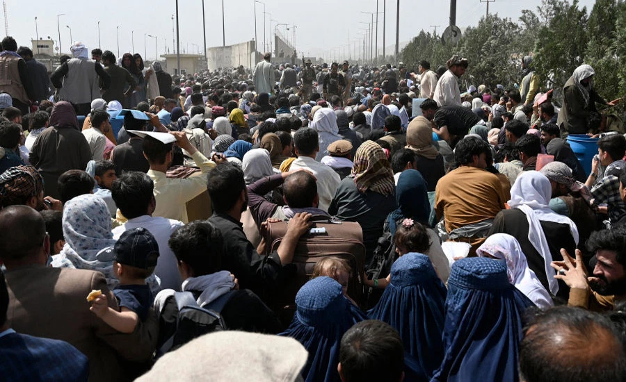 Biden pledges evacuation support, Taliban beat back crowds at airport