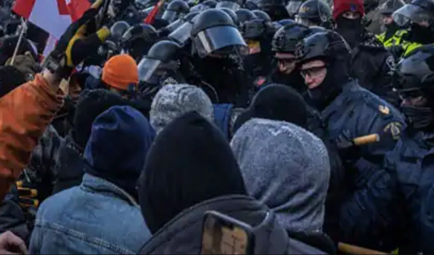 Canadian police arrest dozens to sweep protesters from parliament area