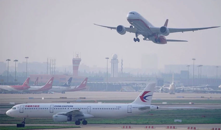 China shortens suspensions for international flights linked to COVID cases