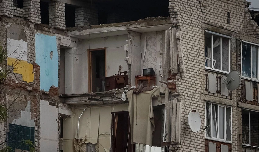 Ukraine's Zelenskiy sees damage in recaptured towns; Russia strikes city water system