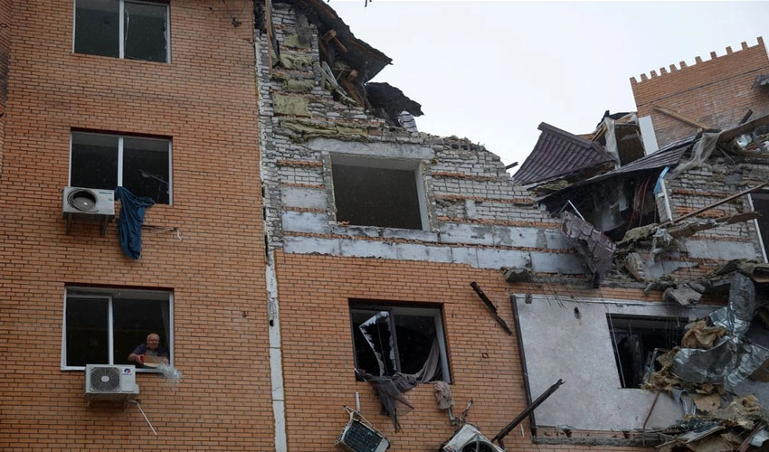 Russia hits Ukraine homes, evacuates Kherson, warns of escalation