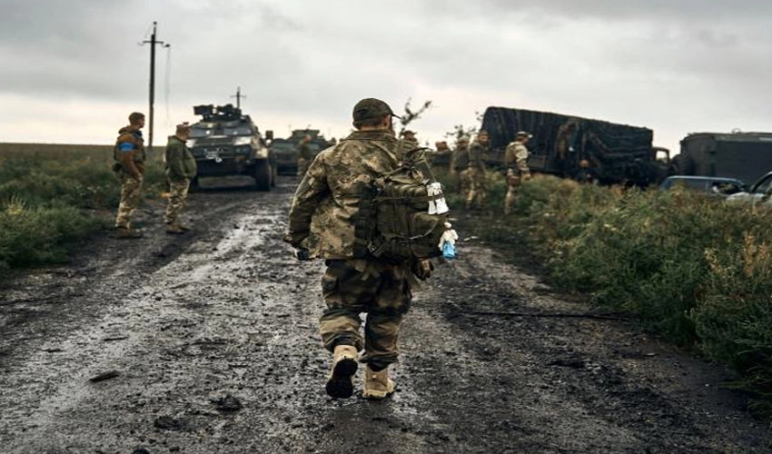 Ukrainian soldiers keep watch at recaptured border
