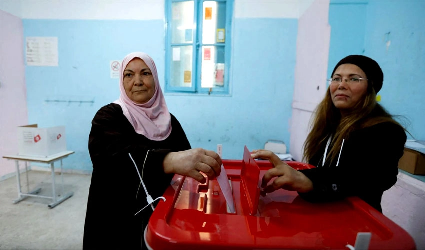 Tunisians vote for neutered parliament in poll shunned by opposition