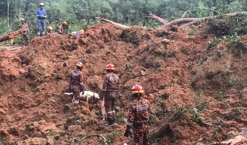 Malaysia landslide toll hits 26 after man found hugging dog