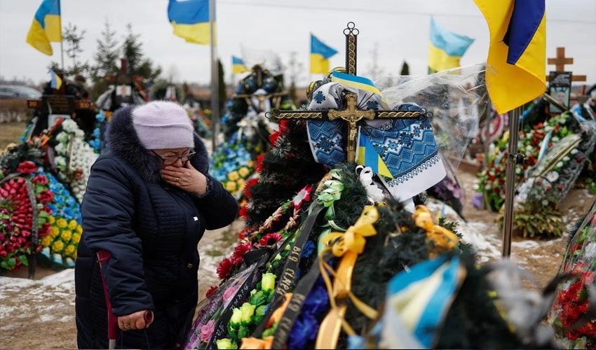 One year into invasion, Ukraine mourns dead and vows victory