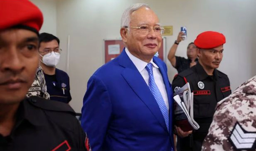 Malaysia's ex-PM Najib jail term halved to six years