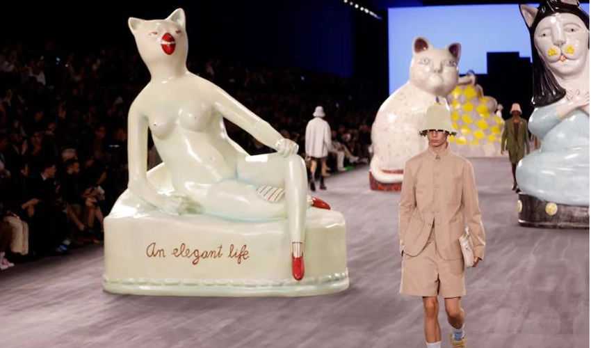 Giant cats stalk the catwalk at the Dior men's show