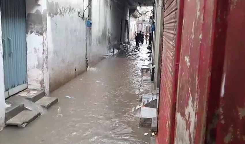 Roads, streets give a pond-like look after incessant rain in Lahore