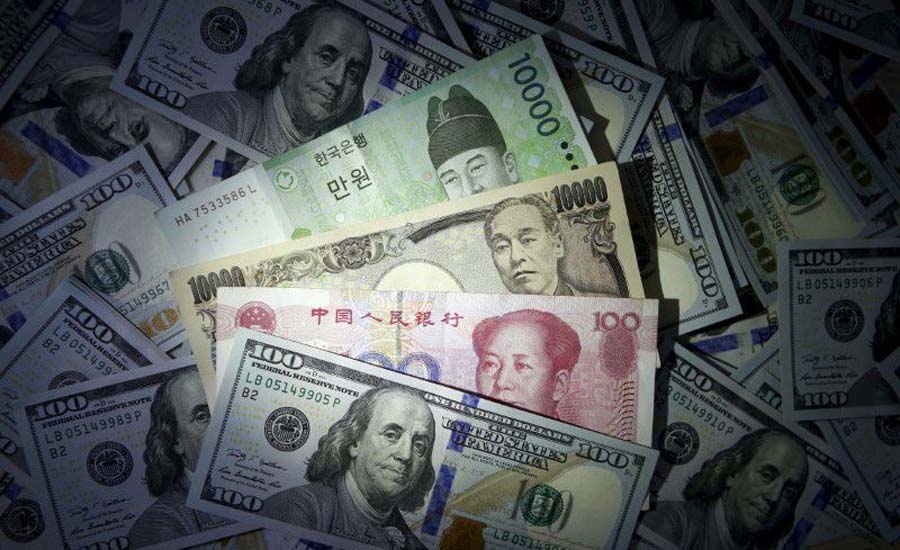 Investors trim long positions on Asian currencies, yuan bets halved