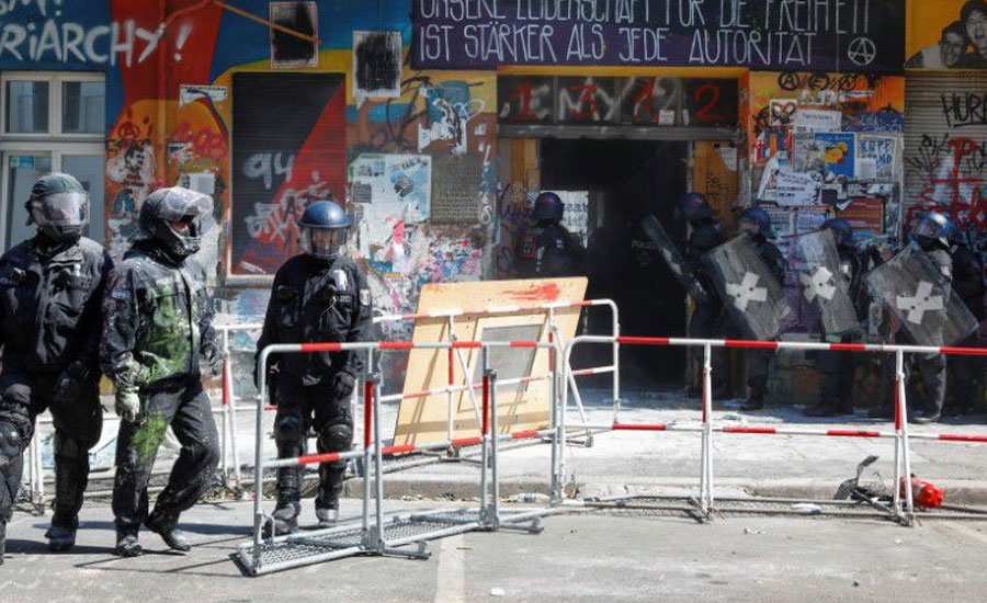 Berlin police force entry to long-time squat under hail of fireworks, smoke bombs